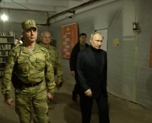 Vladimir Putin visits the national guard headquarters in the Luhansk Region, Russian-controlled...