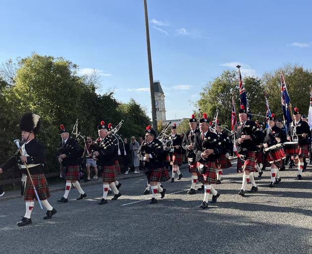 The North Otago Highland Pipeband makes its way down Thames St in Oamaru for the Anzac Day Parade...