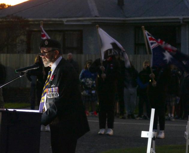 Retired Lieutenant-colonel Kevin Baff leads proceedings during the dawn service in Balclutha....