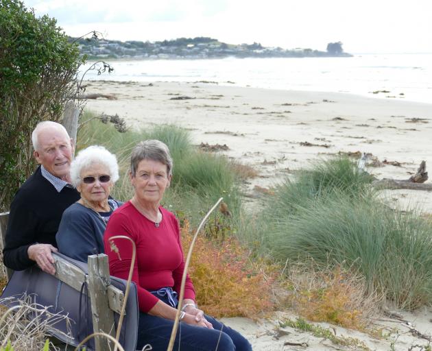 Kaka Point neighbours (from left) Ian and June Kreger and Michelle Rutherford sit on a bench they...