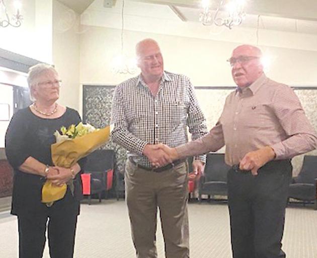 Bruce Robertson (centre) receives Dorset Down national life-membership from Alistar Busch,...
