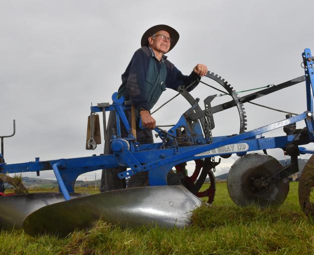 Colin Boon, of Ashburton, tweaks his vintage Reid & Gray plough during practice day at the NZ...