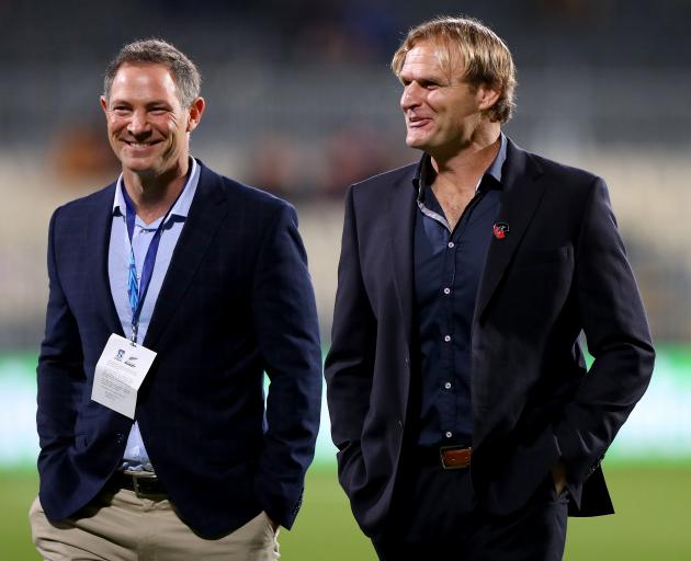 Crusaders head coach Scott Robertson chats with Blues head coach Leon MacDonald. Photo: Getty Images