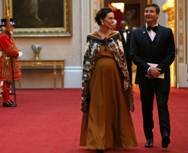 Jacinda Ardern wore a Juliette Hogan gown to meet Queen Elizabeth at Buckingham Palace in 2018....