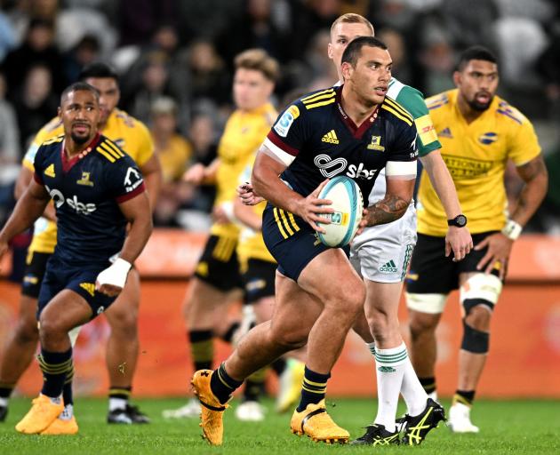 Thomas Umaga-Jensen, of the Highlanders, makes a break against the Hurricanes in their Super...
