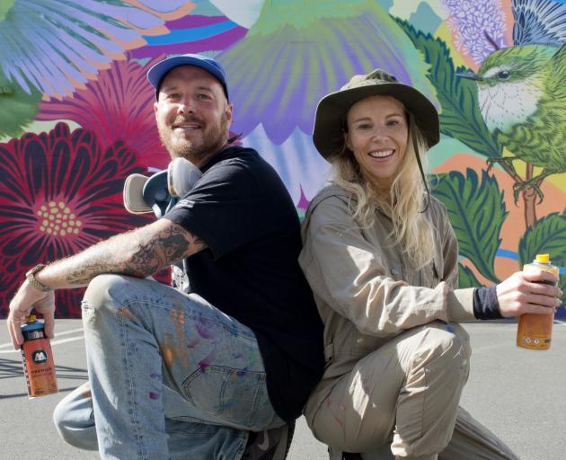 Mural artists Sweats (left) and Flox put the finishing touches to their mural in South Dunedin....