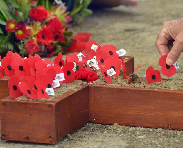 A poppy is laid during an Anzac Day service. PHOTO: ODT FILES