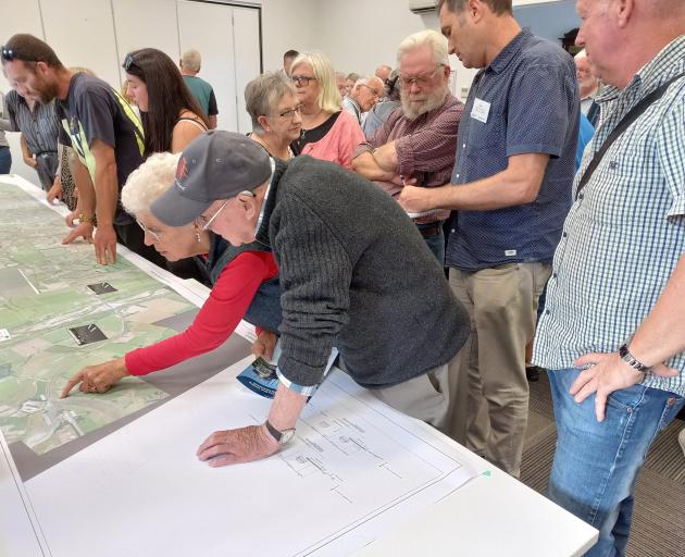 Residents pore over Waka Kotahi NZTA's proposed safety improvements to SH1 during a public drop...
