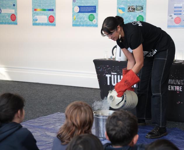 Otago Museum science engagement co-ordinator Pasifika Emily Eastgate conducts experiments with...
