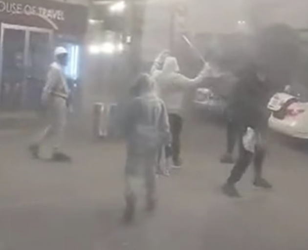 Several of the would-be robbers were brandishing weapons as they were filmed outside The...