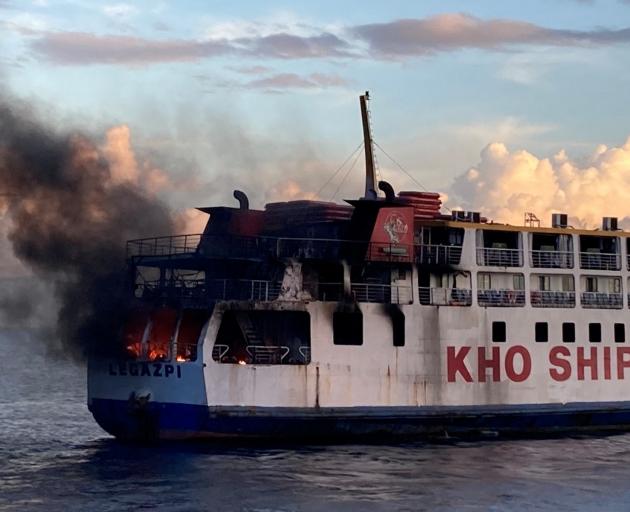 Smoke rises due to a massive fire at a ferry in Bohol, Philippines, on Sunday. Photo: Philippine...
