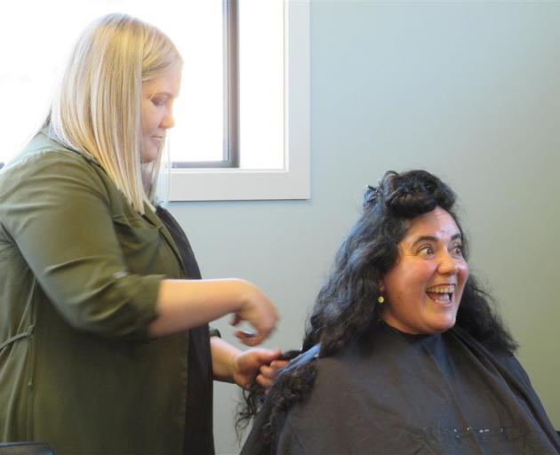 The final few cuts of Paulette Aguayo Torres’ first haircut in 10 years, with 14cm lengths of her...