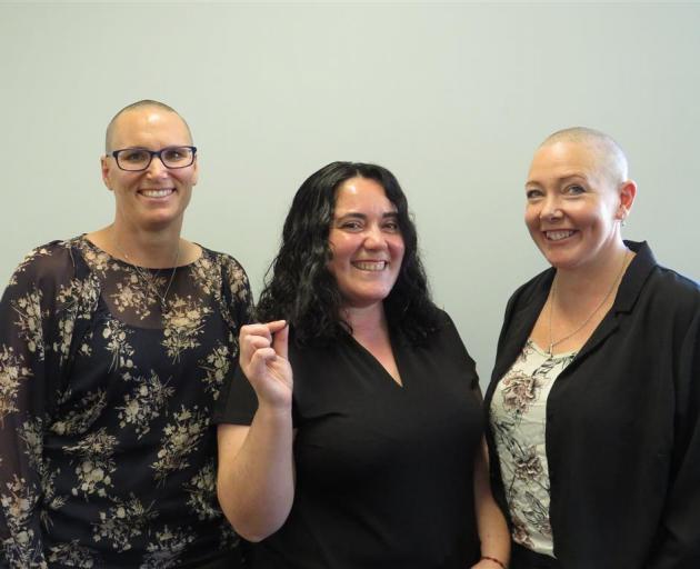 Tessa Skevington, Paulette Aguayo Torres and Holly Chalmers have each cut their hair in support...