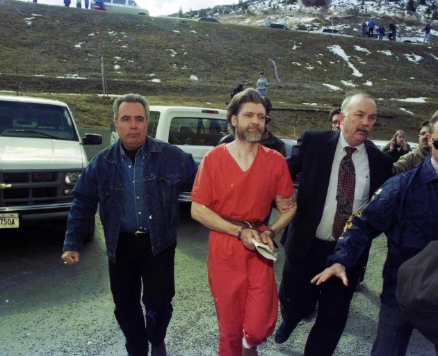 Ted Kaczynski being led into custody by federal marshals in Helena, Montana, in 1996. Photo:...