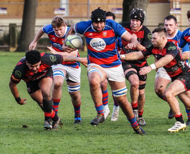 Sydenham lock Caleb Aperahama charges through a gap in the 82-0 win over Christchurch. Photo: B King