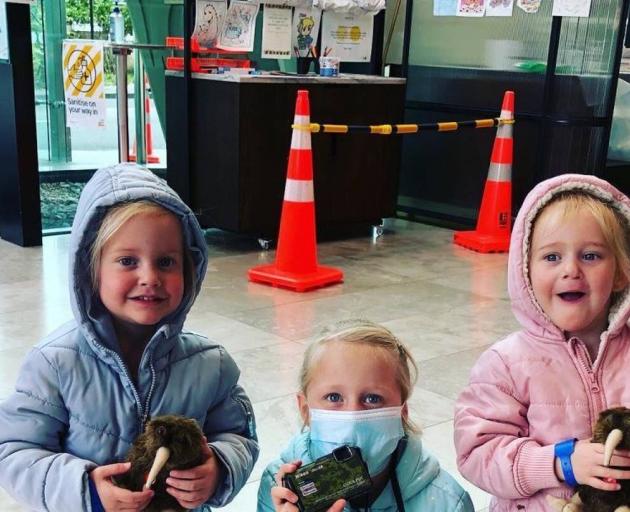 A woman has been charged after two-year-old twins Karla and Maya Dickason and their six-year-old...