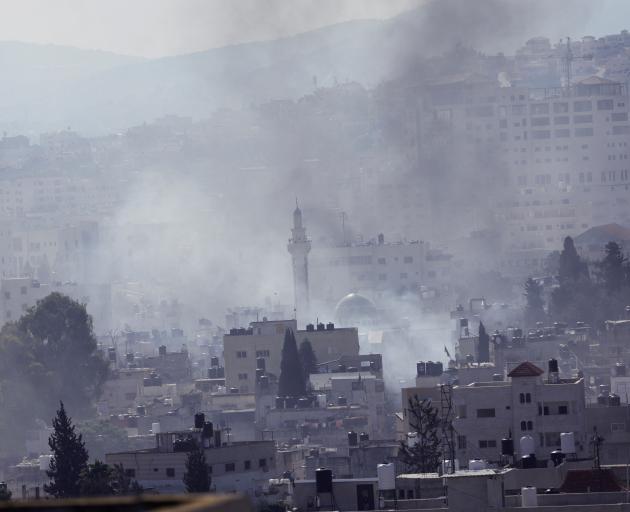 Smoke rises over the city of Jenin in the Israeli-occupied West Bank. Photo: Reuters 