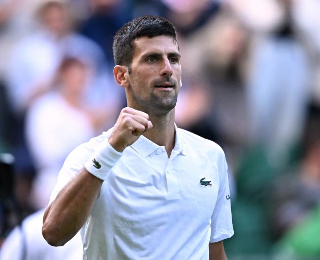 Serbia's Novak Djokovic celebrates after winning his second round match against Australia's...