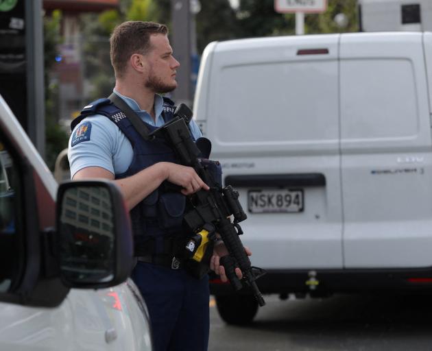 A police officer stands guard in Auckland. Photo: Reuters