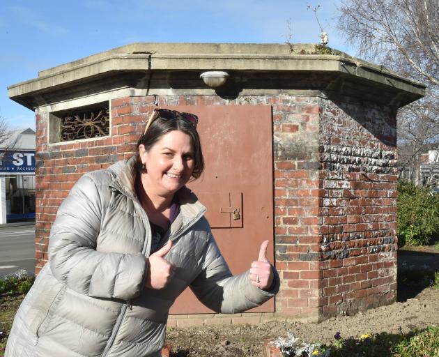 Heritage New Zealand assessment adviser Alison Breese celebrates the Manor Place Conveniences...