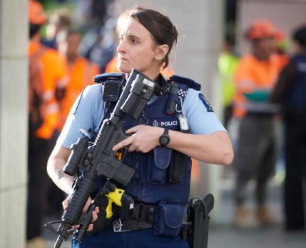 Armed police at the scene in downtown Auckland after a shooting incident which left multiple...