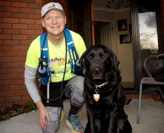 Blair McConnell's black Labrador guide dog Oakley stays home when he goes running. Photo: Geoff...