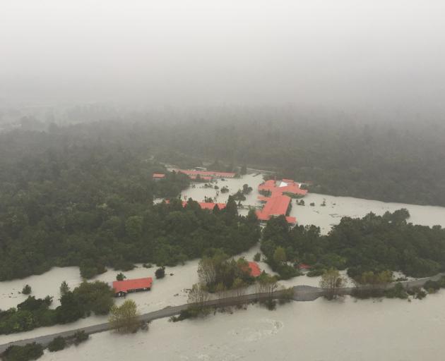 Scenic Hotel Franz Josef Glacier is inundated by flood water after the Waiho (Waiau) River burst...