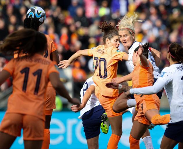 Lindsey Horan eyes the ball as she heads it into the net at Wellington Regional Stadium to level...