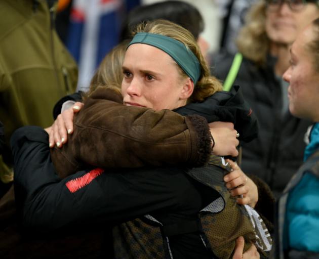 Grace Jale hugs a family member after the 0-0 draw confirming the elimination of the Football...