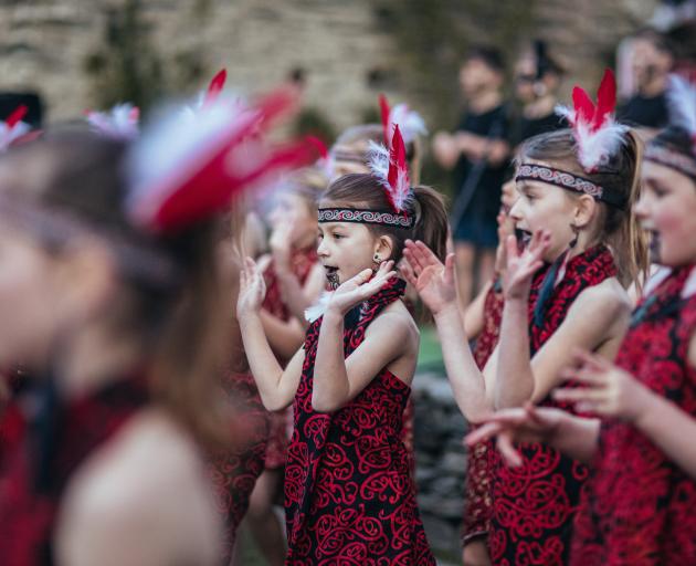 Members of Arrowtown School’s kapa haka group perform on Buckingham Green last night during the...