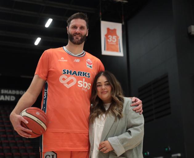 Alex Pledger with his wife Bailee and the jersey 35 which has been retired by the Southland...