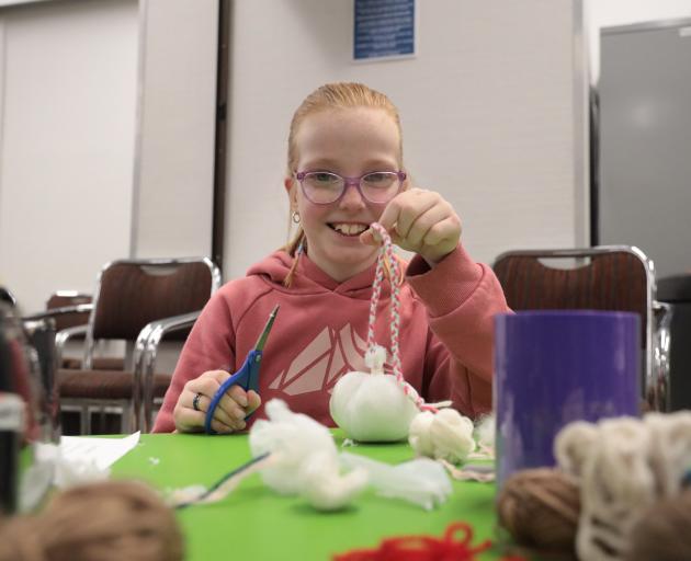 Ruby Strudwicke learns how to make a proper poi for the first time at the Invercargill Public...