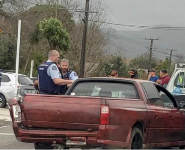 Police at the scene after a fleeing driver crashed into vehicles, narrowly missing pedestrians...