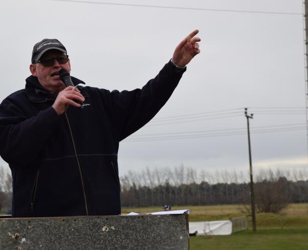 PGG Wrightson auctioneer Ross McKee at work at the 64th annual Gore Dog Sale in 2021. PHOTOS: SRL...