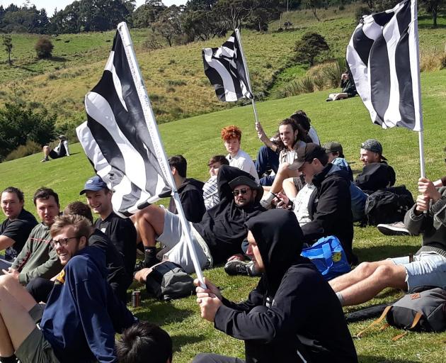 The Northern AFC ultras have a breather before their next round of chanting. Photo: Terry Hibbert