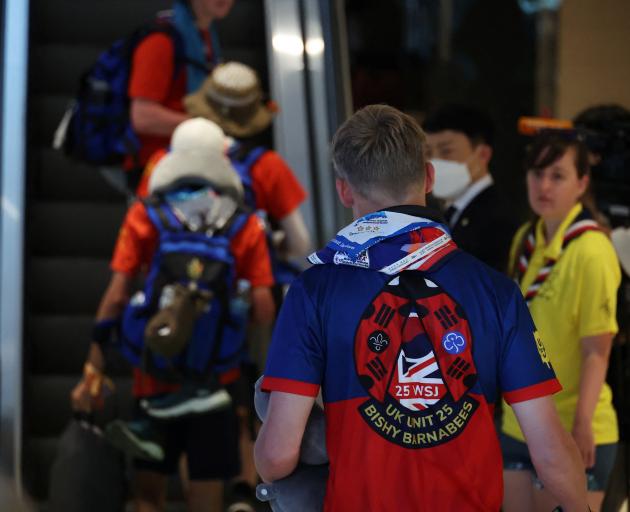 British participants who left a camping site of the 25th World Scout Jamboree arrive at a hotel...