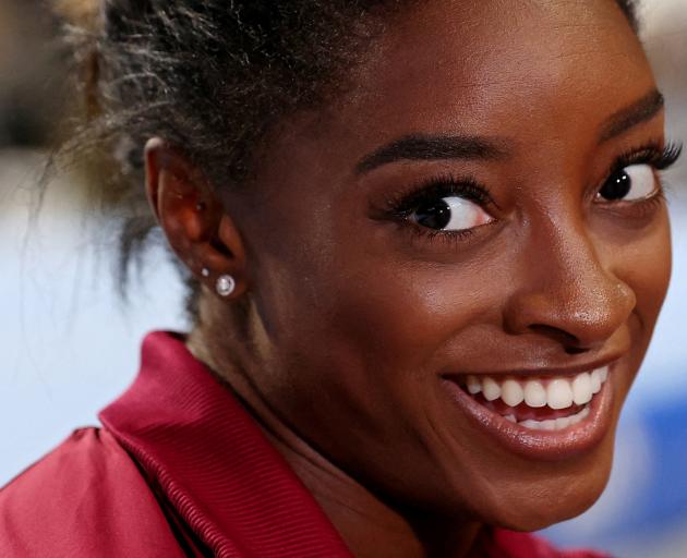 Four-time gold medal-winning gymnast Simone Biles, of the United States, fronts the media after...