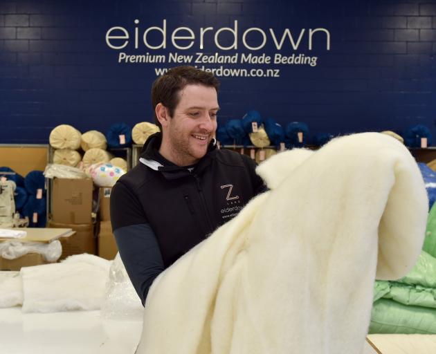 Eiderdown's sales director Lucas Mills with some of the wool used in the company’s various...