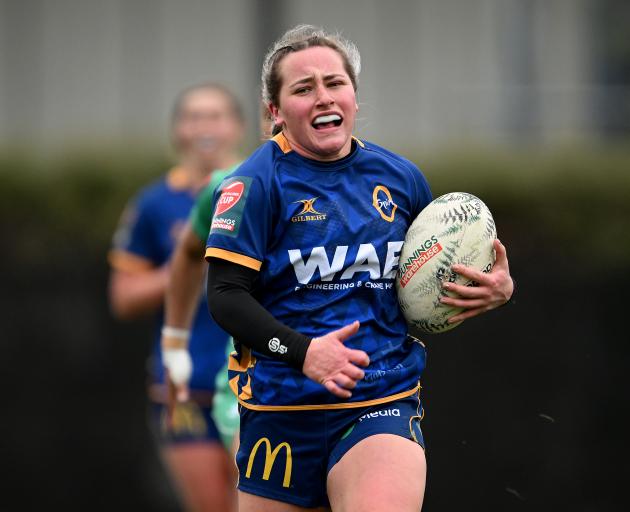 Otago winger Jamie Church charges forward during a Farah Palmer Cup championship match against...