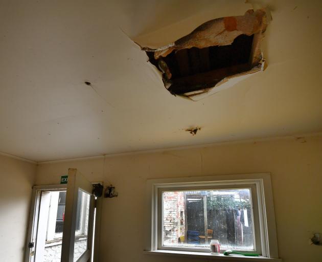 A hole in a boarding house ceiling. Photo: Stephen Jaquiery