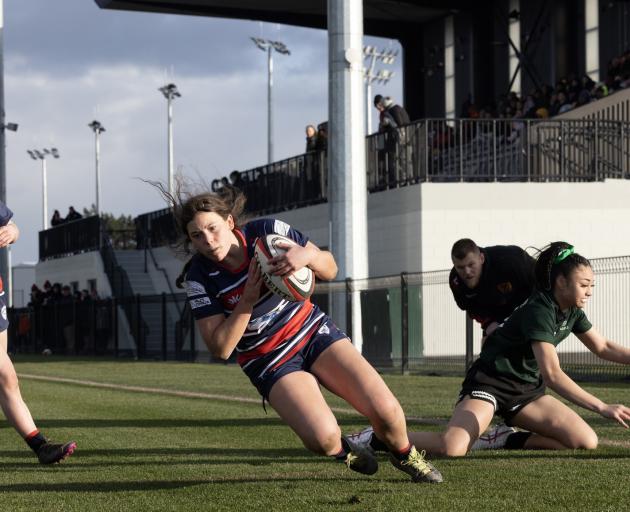 Left wing Tegan Pain crosses the line in the Miles Toyota Cup final. Photo: CGHS Rugby