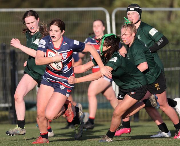 Harriet Cochrane charges through the Avonside Girls' High defence in Christchurch Girls' High's...