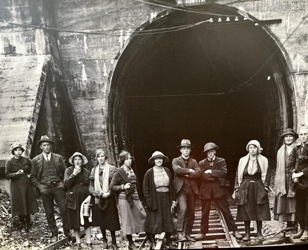 People pose outside the tunnel entrance. Photo: Greymouth Star files