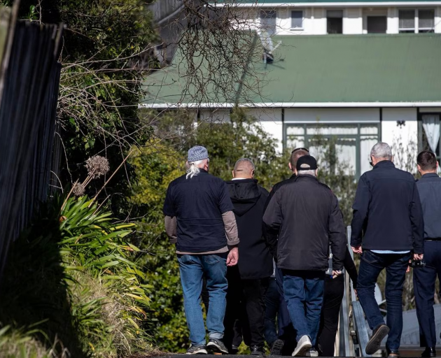 Officials from MBIE, Auckland Council and FENZ arrive to inspect the Oriana Avenue property in...