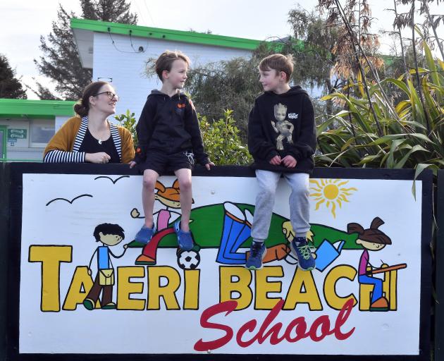Taieri Beach School teacher Lisa O’Mahony, with pupils and siblings Tyla Hulme, left, 5, and...