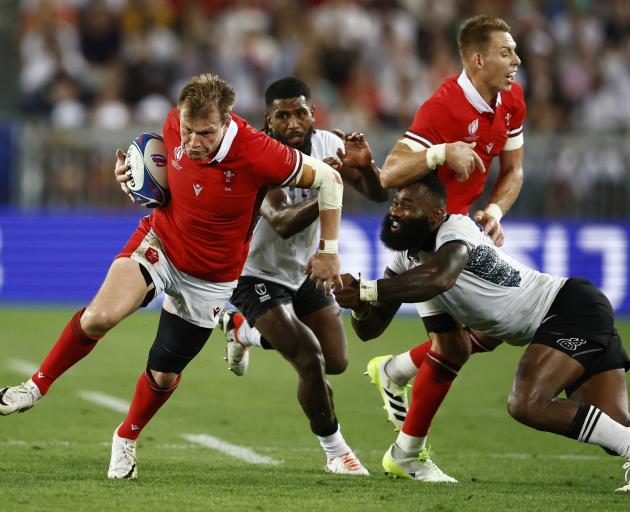 Wales' Nick Tompkins on the charge. Photo: Reuters