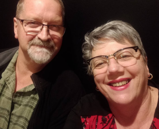 Sharon England, pictured with husband Bruce England, calls her family the "middle of the sandwich...
