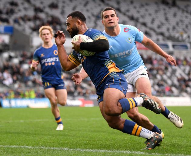 Otago winger Jona Nareki charges towards the tryline as Northland’s Joshua Moorby tries in vain...