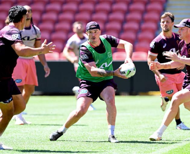 Kobe Hetherington looks to pass during a Broncos training session this week. Photo: Getty Images ...