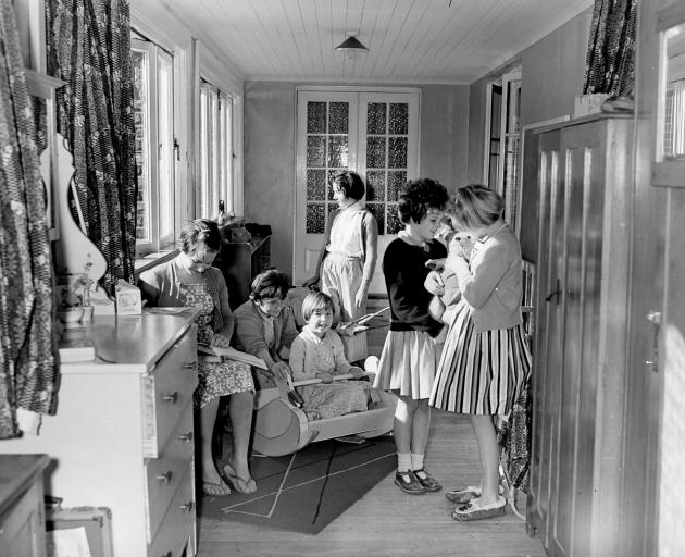 Children gather in the sunroom at Cameron Cottage of Glendining Presbyterian Children’s Homes in...